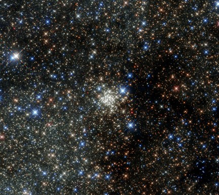 This new NASA/ESA Hubble Space Telescope image presents the Arches Cluster, the densest known star cluster in the Milky Way. It is located about 25 000 light-years from Earth in the constellation of Sagittarius (The Archer), close to the heart of our galaxy, the Milky Way. It is, like its neighbour the Quintuplet Cluster, a fairly young astronomical object at between two and four million years old. The Arches cluster is so dense that in a region with a radius equal to the distance between the Sun and its nearest star there would be over 100 000 stars! At least 150 stars within the cluster are among the brightest ever discovered in the the Milky Way. These stars are so bright and massive, that they will burn their fuel within a short time, on a cosmological scale, just a few million years, and die in spectacular supernova explosions. Due to the short lifetime of the stars in the cluster, the gas between the stars contains an unusually high amount of heavier elements, which were produced by earlier generations of stars. Despite its brightness the Arches Cluster cannot be seen with the naked eye. The visible light from the cluster is completely obscured by gigantic clouds of dust in this region. To make the cluster visible astronomers have to use detectors which can collect light from the X-ray, infrared, and radio bands, as these wavelengths can pass through the dust clouds. This observation shows the Arches Cluster in the infrared and demonstrates the leap in Hubble’s performance since its 1999 image of same object.